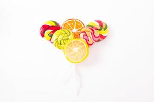 Colorful candy, lollipop and sweets isolated on white background. Top view. Selective focus.
