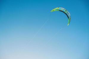 Kitesurfing parachute flies in the sky photo