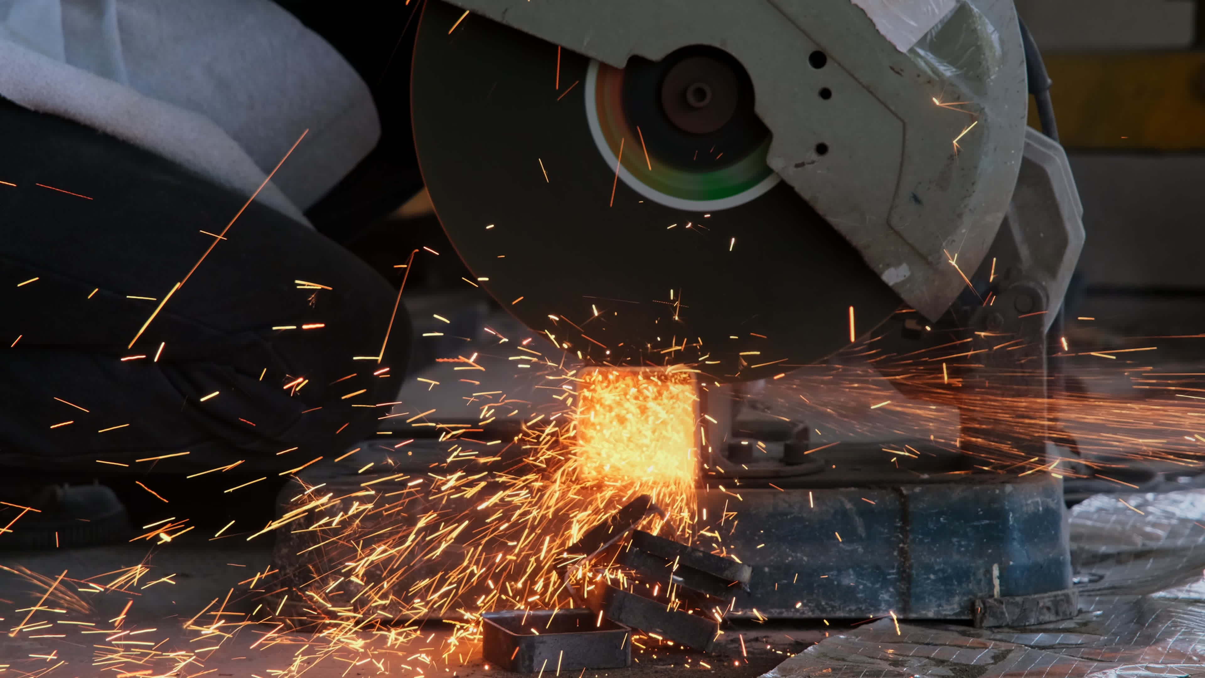 Professional men wearing goggles and construction gloves work in home  workshop with electric steel cutter machine. Cutting metal makes sparks  flying, closeup 7641882 Stock Video at Vecteezy