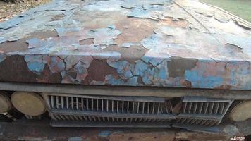 Old car or vintage car Which has peeling color and has cracked color due to the sun and rain. video