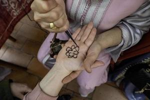 Henna tattoo on the hand photo