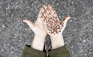 Henna tattoo on the hand photo