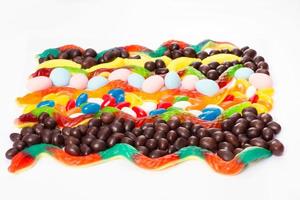 Colorful candy, lollipop and sweets isolated on white background. Top view. Selective focus. photo