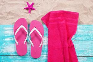 Sand copy space. Sand background top view.Beach towel, beach slippers and starfish photo