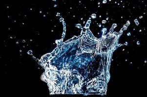 Abstract background of Water splashing on a black background. idea for freshness photo