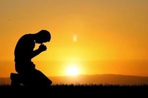 Silhouette of Christian Praying Hands Spiritual and Religious People Praying to God Christianity Concepts photo