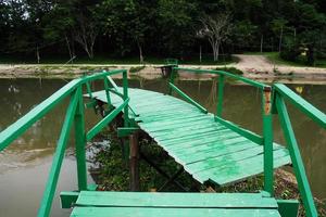 A wooden bridge that collapsed due to the violent flooding. photo