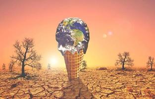 The concept of global warming and environmental change. Melting world on ice cream cone photo