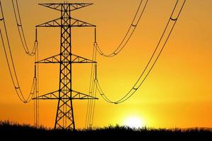 silhouette of the structure of high voltage transmission towers rural electric power distribution concept photo