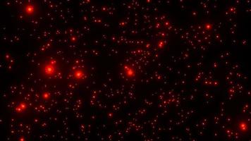 fuoco di particelle rosse che cade su sfondo nero. video