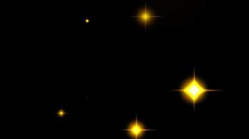 Animation yellow light sparkles on black background. video