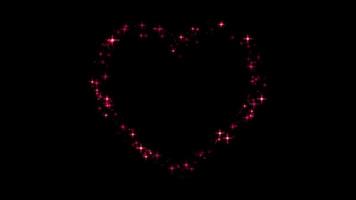 Animation red light sparkles heart shape on black background. video