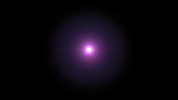 Realistic purple light lens flare on black background. video