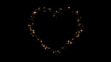 Animation yellow light sparkles heart shape on black background. video