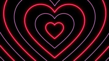 animación forma de corazones de luz de neón rojo sobre fondo negro. video