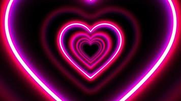 Animation pink neon light hearts shape on black background.