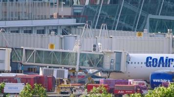 Passengers boarding the airliner through jet bridge video