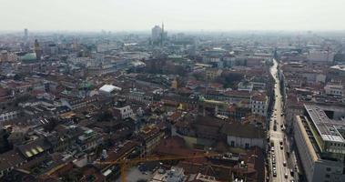 Aerial view of Milan city from above. Flying over Milan city center with people walking down the narrow streets of Milan. video