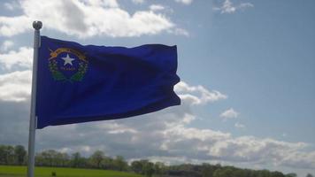 Flag of Nevada state, region of the United States, waving at wind video