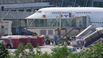 Disabled passengers boarding in plane by jetway terminal video