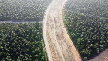 Aerial view red clay soil after land clearing at oil palm estate video