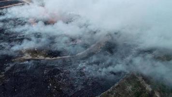 Aerial view fire burning at garbage dump site video
