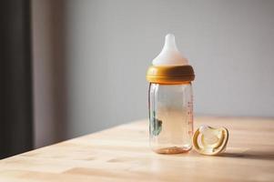milk bottle and pacifier photo