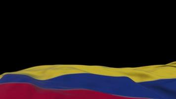 bandeira de tecido da colômbia acenando no loop de vento. bordado colombiano bandeira de pano costurada balançando na brisa. fundo preto meio preenchido. lugar para texto. Ciclo de 20 segundos. 4k video