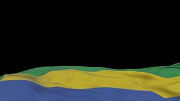 bandeira de tecido do gabão acenando no loop de vento. bordado gabonese bandeira de pano costurada balançando na brisa. fundo preto meio preenchido. lugar para texto. Ciclo de 20 segundos. 4k video