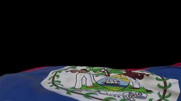 Belize fabric flag waving on the wind loop. Belizean embroidery stiched cloth banner swaying on the breeze. Half-filled black background. Place for text. 20 seconds loop. 4k video