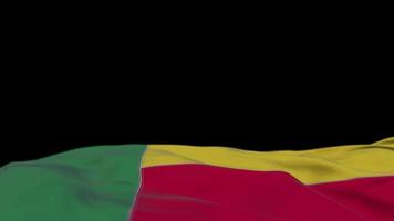 Benin fabric flag waving on the wind loop. Benin embroidery stiched cloth banner swaying on the breeze. Half-filled black background. Place for text. 20 seconds loop. 4k video