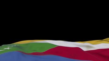 bandiera in tessuto delle Comore che sventola sul passante del vento. striscione di stoffa ricamato comoriano che ondeggia sulla brezza. sfondo nero riempito a metà. posto per il testo. Ciclo di 20 secondi. 4k video