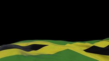 Jamaica fabric flag waving on the wind loop. Jamaican embroidery stiched cloth banner swaying on the breeze. Half-filled black background. Place for text. 20 seconds loop. 4k video