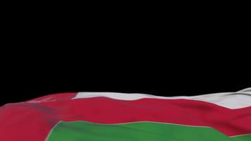 Oman fabric flag waving on the wind loop. Omani embroidery stiched cloth banner swaying on the breeze. Half-filled black background. Place for text. 20 seconds loop. 4k video