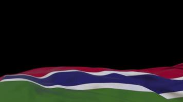 Gambia fabric flag waving on the wind loop. Gambian embroidery stiched cloth banner swaying on the breeze. Half-filled black background. Place for text. 20 seconds loop. 4k video