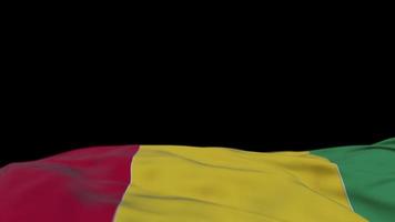 Guinea fabric flag waving on the wind loop. Guinean embroidery stiched cloth banner swaying on the breeze. Half-filled black background. Place for text. 20 seconds loop. 4k video