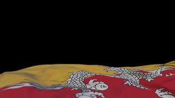 bandeira de tecido do Butão acenando no loop de vento. bandeira de pano costurada com bordado butanês balançando na brisa. fundo preto meio preenchido. lugar para texto. Ciclo de 20 segundos. 4k video