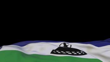 Lesotho fabric flag waving on the wind loop. Lesotho embroidery stiched cloth banner swaying on the breeze. Half-filled black background. Place for text. 20 seconds loop. 4k video