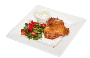 roasted chicken with vegetables on a white plate photo