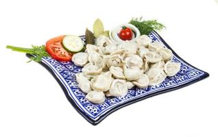 Bowl with traditional russian dish - pelmeni photo