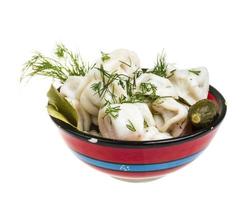 Bowl with traditional russian dish - pelmeni photo