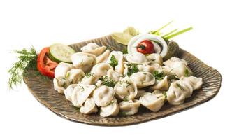 Bowl with traditional russian dish - pelmeni photo