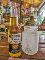 Playa del Carmen Quintana Roo Mexico 2022 Corona beer bottle in restaurant PapaCharly Playa del Carmen Mexico. photo