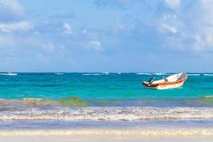 Tulum Quintana Roo Mexico 2022 Waves boats pelicans caribbean coast and beach panorama Tulum Mexico. photo