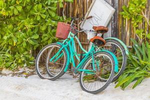 Tulum Quintana Roo Mexico 2022 Turquoise bikes bicycles at caribbean coast and beach Tulum Mexico.