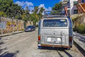 Playa del Carmen Quintana Roo Mexico 2022 Old black broken dirty VW bus Volkswagen car rusting Mexico. photo