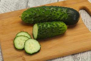 Ripe fresh green two cucumbers photo