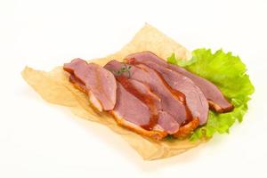 Sliced smoked duck breast served salad photo