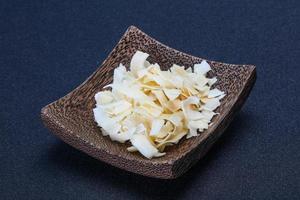 Coconut dry chips in the bowl photo