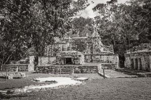 Ancient Mayan site with temple ruins pyramids artifacts Muyil Mexico. photo